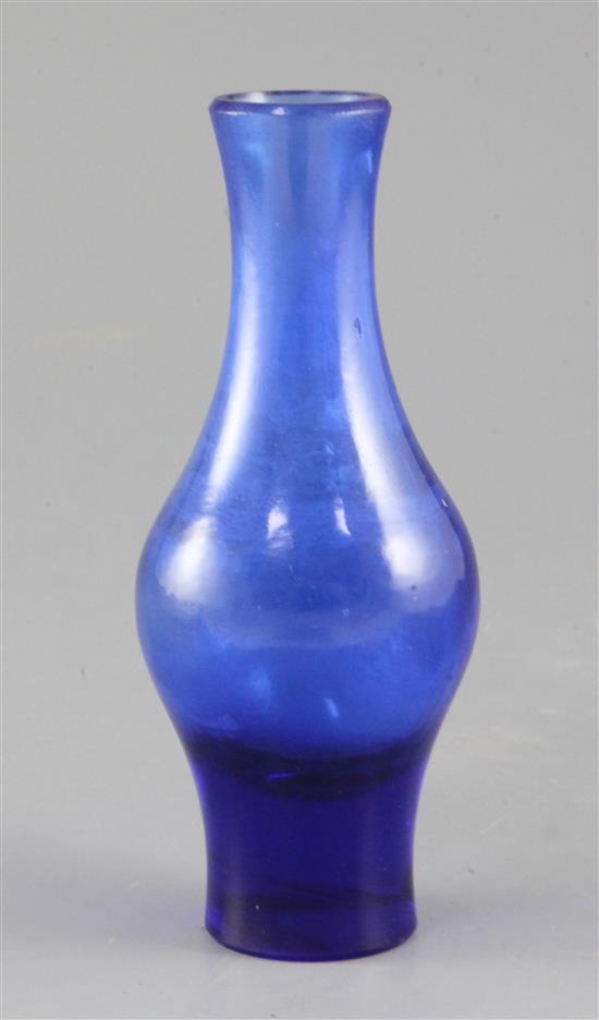 A Chinese Beijing blue glass baluster vase, 18.2cm, remnants of gilding to the engraved mark